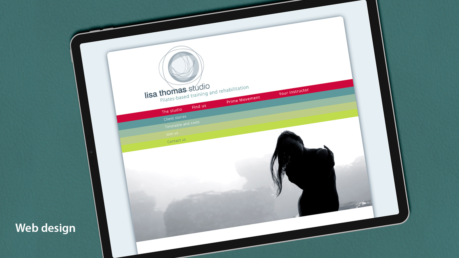 Tablet computer displaying a Pilates studio web site.