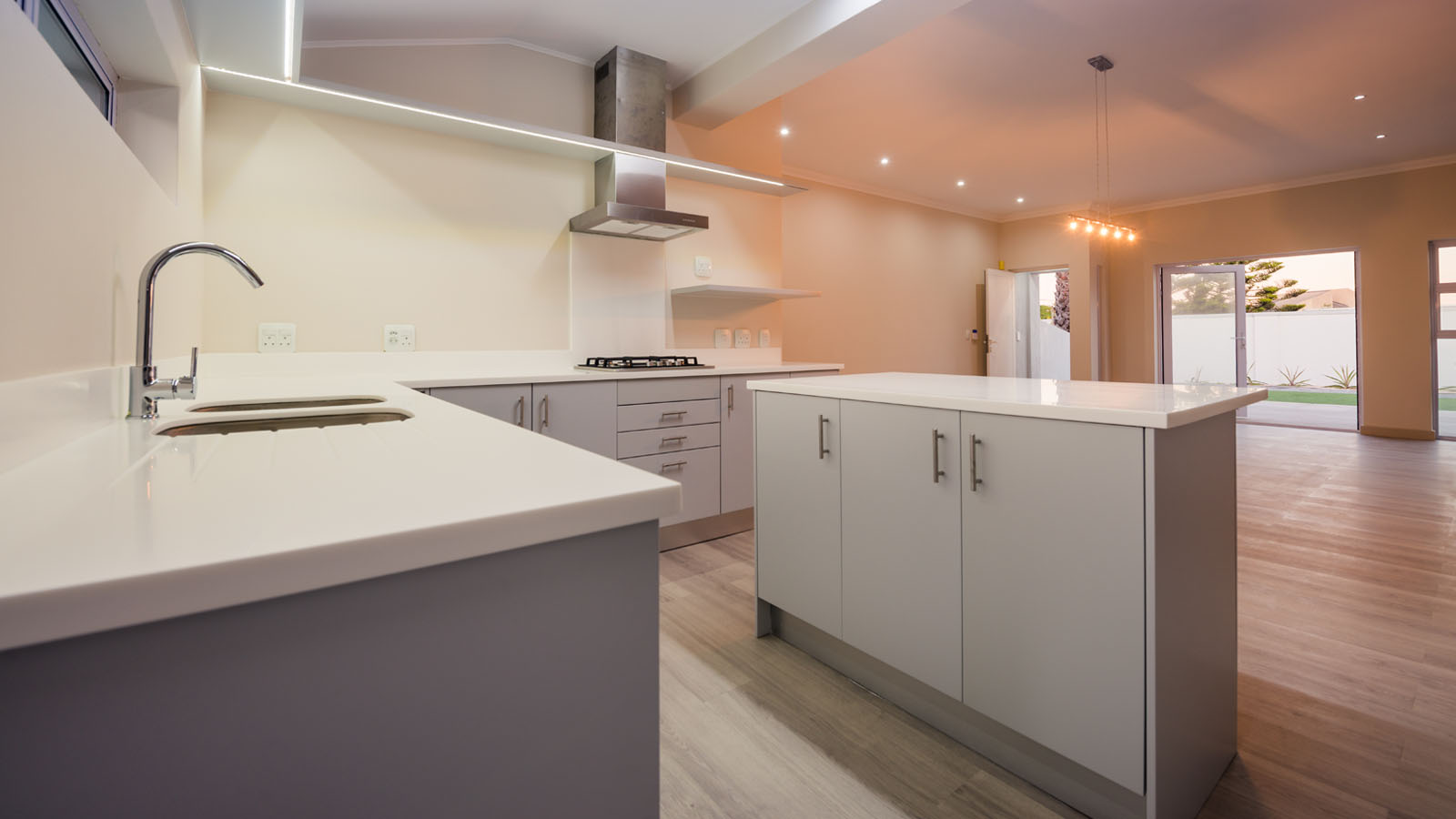 View of kitchen and lounge area of a newly built house.