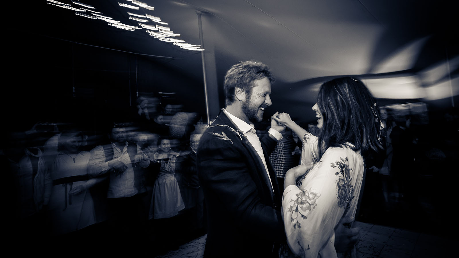 Newlyweds enjoying themselves on the dance floor.