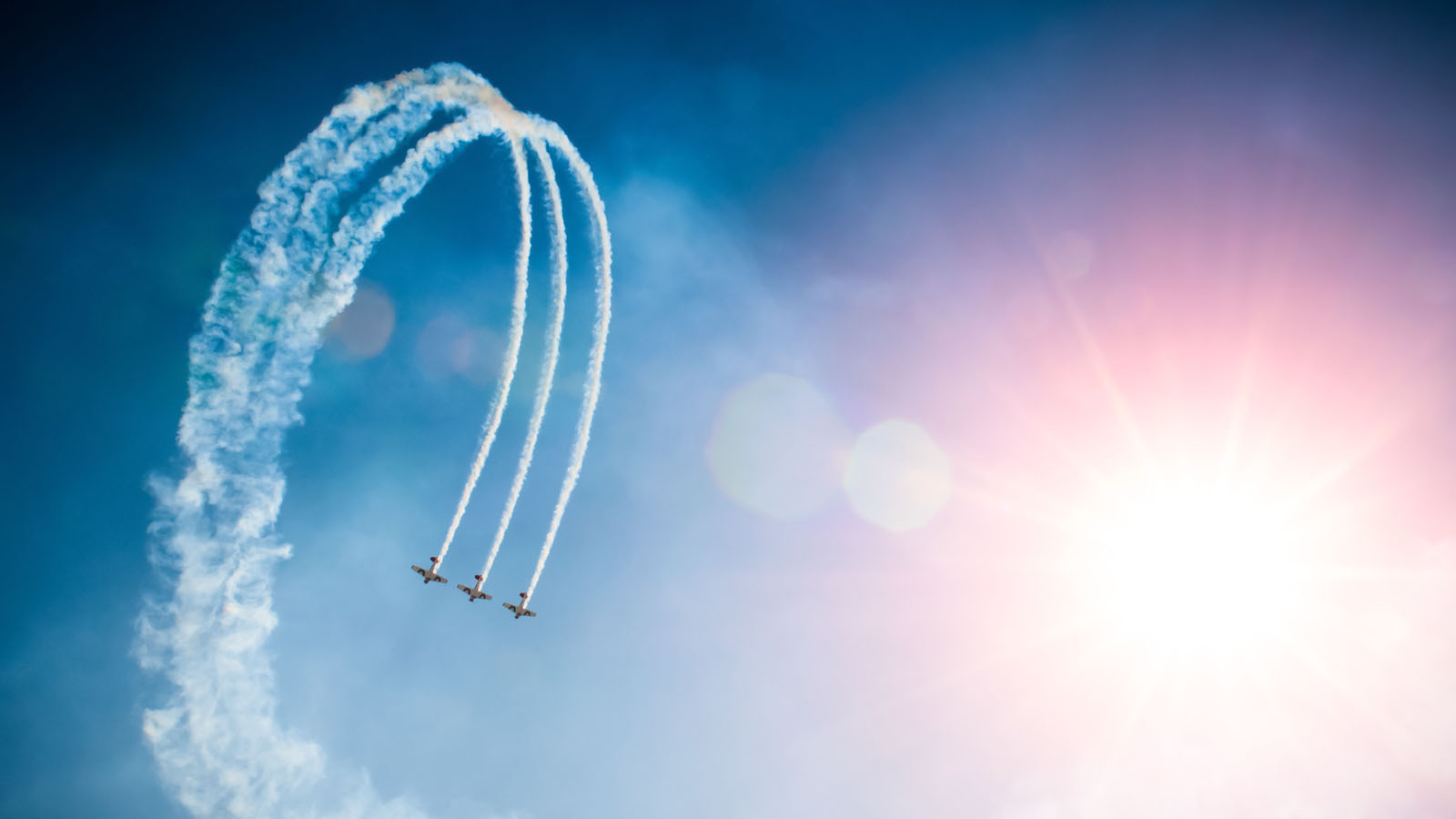 Large formation display by three-ship aerobatic team.